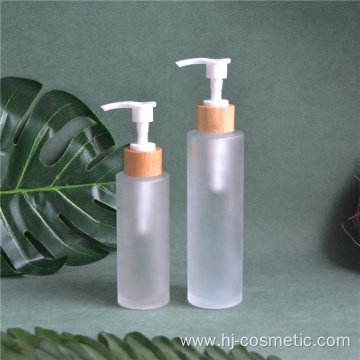 wholesale Frost 150ml 100ml glass bottle with bamboo wooden lotion sprayer pump Customized Made Cosmetic packaging